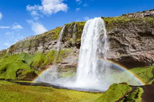 Golden Circle Route Gallery: Mighty Seljalandsfoss waterfall with rainbow in summer, Iceland