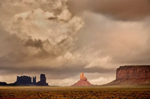 <b class=qtipBold><figcaption>Monument Valley Storm Clouds</figcaption></b><br>Monument Valley, a red-sand desert region on the Arizona-Utah border, known for the towering sandstone buttes of Monument Valley Navajo Tribal Park. The famous, steeply sloped Mittens buttes can be viewed from the road or from overlooks such as John Ford's Point.<br><em>© ©RussBurden</em> Monument Valley Storm Clouds