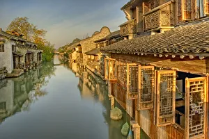 <b class=qtipBold><figcaption>Morning sunshine at Wuzhen</figcaption></b><br>Town of Wuzhen in early morning, after sunrise. Wuzhen is ancient town in Zhejiang province, famous for its criss-crossing waterways and canals. All houses are built along water front.<br><em>© 2008 Xiaoyu Yu</em> Morning sunshine at Wuzhen
