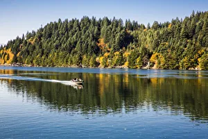 Motor Speed Boat and Passengers glides fast on water, Columbia River Gorge, Hood River, Oregon, USA Motor Speed Boat and Passengers glides fast on water, Columbia River Gorge, Hood River, Oregon, USA