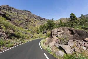 Mountain chain and a country road, El Pie de la Cuesta, Roque Bentaiga, Gran Canaria Mountain chain and a country road, El Pie de la Cuesta, Roque Bentaiga, Gran Canaria