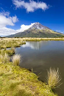 Mountain lake with the Mount Taranaki volcano, Pouakai Range, Egmont National Park Mountain lake with the Mount Taranaki volcano, Pouakai Range, Egmont National Park