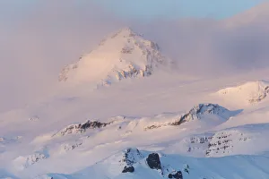 Mountains near glacier glowing in dawns light, Vatnajokull Glacier Mountains near glacier glowing in dawns light, Vatnajokull Glacier