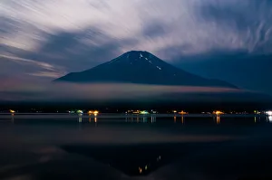 <b class=qtipBold><figcaption>Mt. Fuji</figcaption></b><br>Beautiful scenery in Japan. Night view from Lake Yamanakako The surface of the lake reflects the mountain like a mirror.<br><em>© Shinya KUDO</em> Mt. Fuji