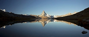 Mt Matterhorn with reflections in Stellisee Lake in the first morning light, Zermatt, Valais, Switzerland, Europe Mt Matterhorn with reflections in Stellisee Lake in the first morning light, Zermatt, Valais, Switzerland, Europe