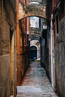 Narrow Old town street in Venice at the morning Narrow Old town street in Venice at the morning