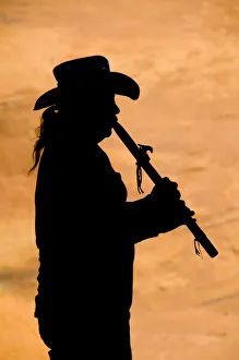 <b class=qtipBold><figcaption>Navajo in silhouette playing flute</figcaption></b><br>Russell Burden, 147541199<br><em>© Russell Burden</em> Navajo in silhouette playing flute