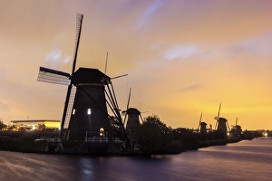 Netherlands, South Holland, Kinderdijk , Silhouette of traditional windmills Netherlands, South Holland, Kinderdijk , Silhouette of traditional windmills