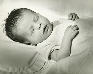Newborn (0-3 months) sleeping in crib, (B&W) Newborn (0-3 months) sleeping in crib, (B&W)