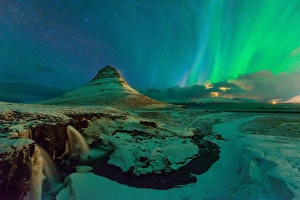 <b class=qtipBold><figcaption>Northern Lights at Mt. Kirkjufell</figcaption></b><br>Kirkjufell or Church mountain is a high mountain on the north coast of Iceland's Snaefellsnes peninsula, near the town of Grundarfjrur.<br><em>© 2015 Anan Charoenkal</em> Northern Lights at Mt. Kirkjufell