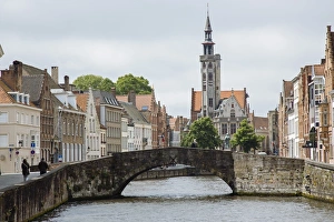 Old stone bridge across the canal in Bruges, West Flanders, Belgium Old stone bridge across the canal in Bruges, West Flanders, Belgium
