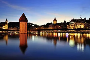 Old town of Lucerne with Kapellbrucke bridge, Wasserturm tower and the Reuss river Old town of Lucerne with Kapellbrucke bridge, Wasserturm tower and the Reuss river