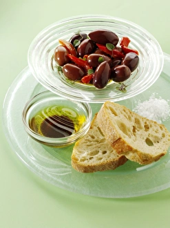 Olives with ciabatta bread and oil for dipping, snacks Olives with ciabatta bread and oil for dipping, snacks