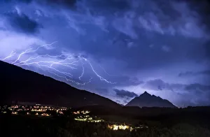 Ominous clouds and lightning bolts from thunderclouds over the Stubai Valley near Ominous clouds and lightning bolts from thunderclouds over the Stubai Valley near
