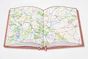 Open atlas, showing road map across double page Open atlas, showing road map across double page