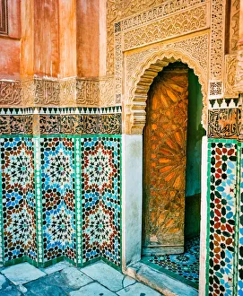Ornate Tiled Wall and Open Wooden Door in Marrakech Morocco Ornate Tiled Wall and Open Wooden Door in Marrakech Morocco