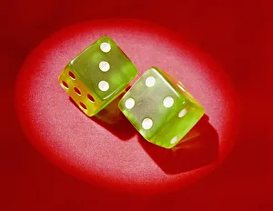 Pair of green plastic dice, showing lucky 7'. (Photo by H Pair of green plastic dice, showing lucky 7'. (Photo by H