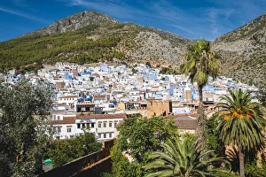 Panoramic aerial view of Chefchaouen city skyline in front of the Rif mountains, Morocco Panoramic aerial view of Chefchaouen city skyline in front of the Rif mountains, Morocco