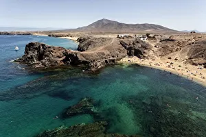 Papagayo beaches or Playas de Papagayo, Playa Blanca in the back, Lanzarote, Canary Islands Papagayo beaches or Playas de Papagayo, Playa Blanca in the back, Lanzarote, Canary Islands