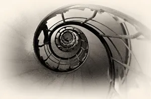<b class=qtipBold><figcaption>Paris Stairs</figcaption></b><br>A picture taken up from the bottom of a circular staircase. The bleached picture and black staircase creates an interesting pattern reminiscent of a nautilus.<br><em>© Lenz Copyright 2015</em> Paris Stairs
