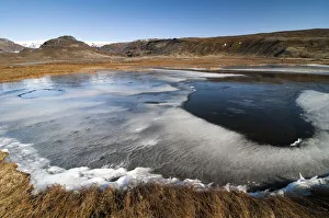 Partly frozen lake near Dyrholaey, Myrdalsjoekull Glacier, south coast, Iceland, Europe Partly frozen lake near Dyrholaey, Myrdalsjoekull Glacier, south coast, Iceland, Europe