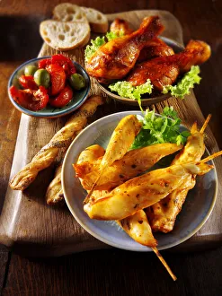 Party buffet with chicken satay and grilled chicken legs Party buffet with chicken satay and grilled chicken legs