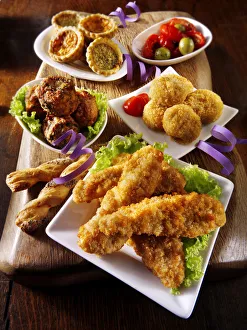 Party buffet food with Southern fried chicken, onion balls Party buffet food with Southern fried chicken, onion balls