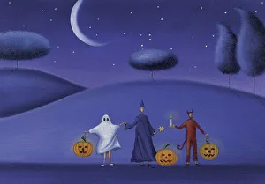 Three People Holding Hands Dresed in Halloween Costumes and Holding Pumpkins Three People Holding Hands Dresed in Halloween Costumes and Holding Pumpkins