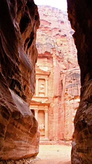 Petra Archaeological site - The Treasury seen from the Siq exit Petra Archaeological site - The Treasury seen from the Siq exit
