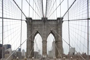 Prints of Converging lines of suspension cables and massive tower on Brooklyn Bridge with Manhattan skyline in background World Famous Bridges Prints: Brooklyn Bridge Print: Converging Lines of Steel and Skyline