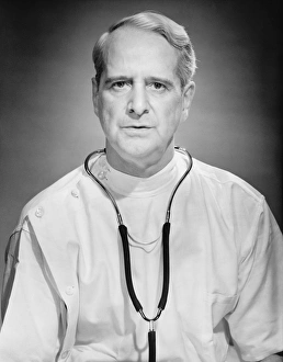 Physician posing in studio, (B&W), portrait Physician posing in studio, (B&W), portrait