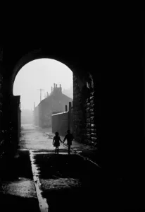 Glasgow Prints: Print of two children walking under an arch in the Gorbals area of Glasgow