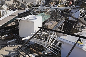 Pile of discarded household and industrial items at a scrap metal recycling centre Pile of discarded household and industrial items at a scrap metal recycling centre