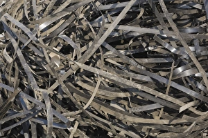 Pile of discarded metal straps at a scrap metal recycling centre, Quebec, Canada Pile of discarded metal straps at a scrap metal recycling centre, Quebec, Canada