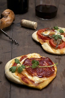 Pizzette, small pizzas with buffalo mozzarella, chorizo and coriander, front Pizzette, small pizzas with buffalo mozzarella, chorizo and coriander, front