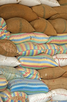 Plump bags of rice stacked in a rice warehouse, Battambang, Cambodia, Southeast Asia, Asia Plump bags of rice stacked in a rice warehouse, Battambang, Cambodia, Southeast Asia, Asia
