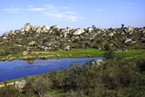 Pond and granite rocks in the Los Barruecos Nature Monument, Extremadura, Spain, Europe Pond and granite rocks in the Los Barruecos Nature Monument, Extremadura, Spain, Europe