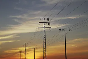 Power poles, sunset, Upper Swabia, Baden-Wuerttemberg, Germany, Europe Power poles, sunset, Upper Swabia, Baden-Wuerttemberg, Germany, Europe