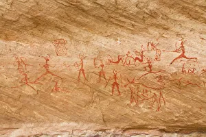 Prehistoric rock drawings in the Awis Valley, Akakus Mountains, Libyan Desert, Libya Prehistoric rock drawings in the Awis Valley, Akakus Mountains, Libyan Desert, Libya