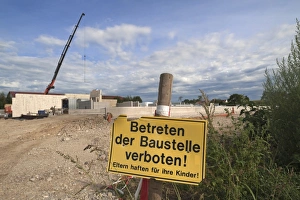Prohibition sign keep off construction site, construction of a modern cow shed, Bavaria Prohibition sign keep off construction site, construction of a modern cow shed, Bavaria