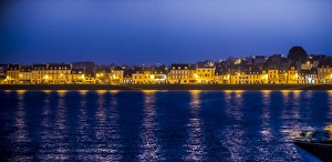 Quai with illuminated houses, Camaret-sur-Mer, Departement Finistere, Brittany, France Quai with illuminated houses, Camaret-sur-Mer, Departement Finistere, Brittany, France