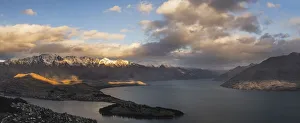 Queenstown on Lake Wakatipu and The Remarkbales mountain range at sunset, Otago Region Queenstown on Lake Wakatipu and The Remarkbales mountain range at sunset, Otago Region
