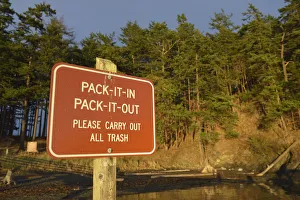 Rad sign informing to take all trash from park out, James Island, San Juan Islands Rad sign informing to take all trash from park out, James Island, San Juan Islands