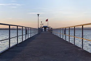 Railing of the ship pier of Mannenbach in the evening light, Lake Constance Railing of the ship pier of Mannenbach in the evening light, Lake Constance