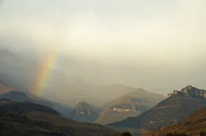 Rainbow at the base of the Amphitheatre range in the Drakensberg Mountains, Royal Natal Rainbow at the base of the Amphitheatre range in the Drakensberg Mountains, Royal Natal