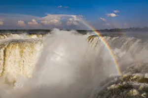 Rainbow over the Iguazu Falls at sunset Rainbow over the Iguazu Falls at sunset
