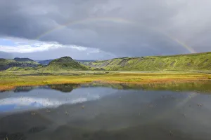 Rainbow over a small lake near Soelheimajoekulsvegur, Iceland Rainbow over a small lake near Soelheimajoekulsvegur, Iceland