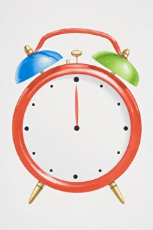 Red alarm clock with green and blue bells on top Red alarm clock with green and blue bells on top