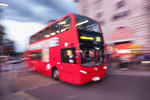 Red double decker bus, motion blur, Piccadilly Circus, London, England, United Kingdom Red double decker bus, motion blur, Piccadilly Circus, London, England, United Kingdom