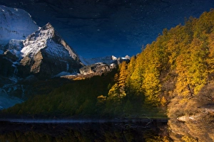 The reflection of snow mountain peak in Yading The reflection of snow mountain peak in Yading